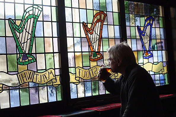 drinking beer Man drinking glass of beer