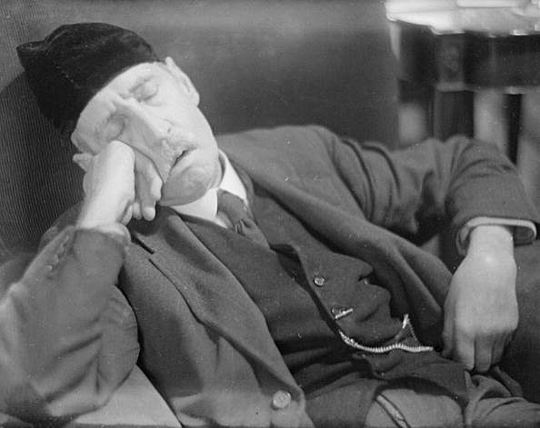 man sleeping man sleeping on chair