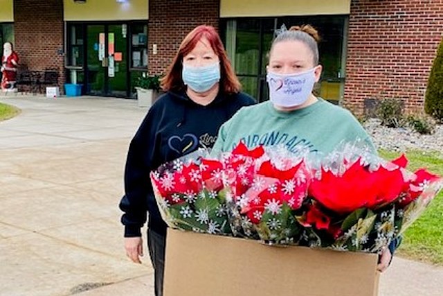 Angels Deliver Poinsettias to Nursing Home Residents